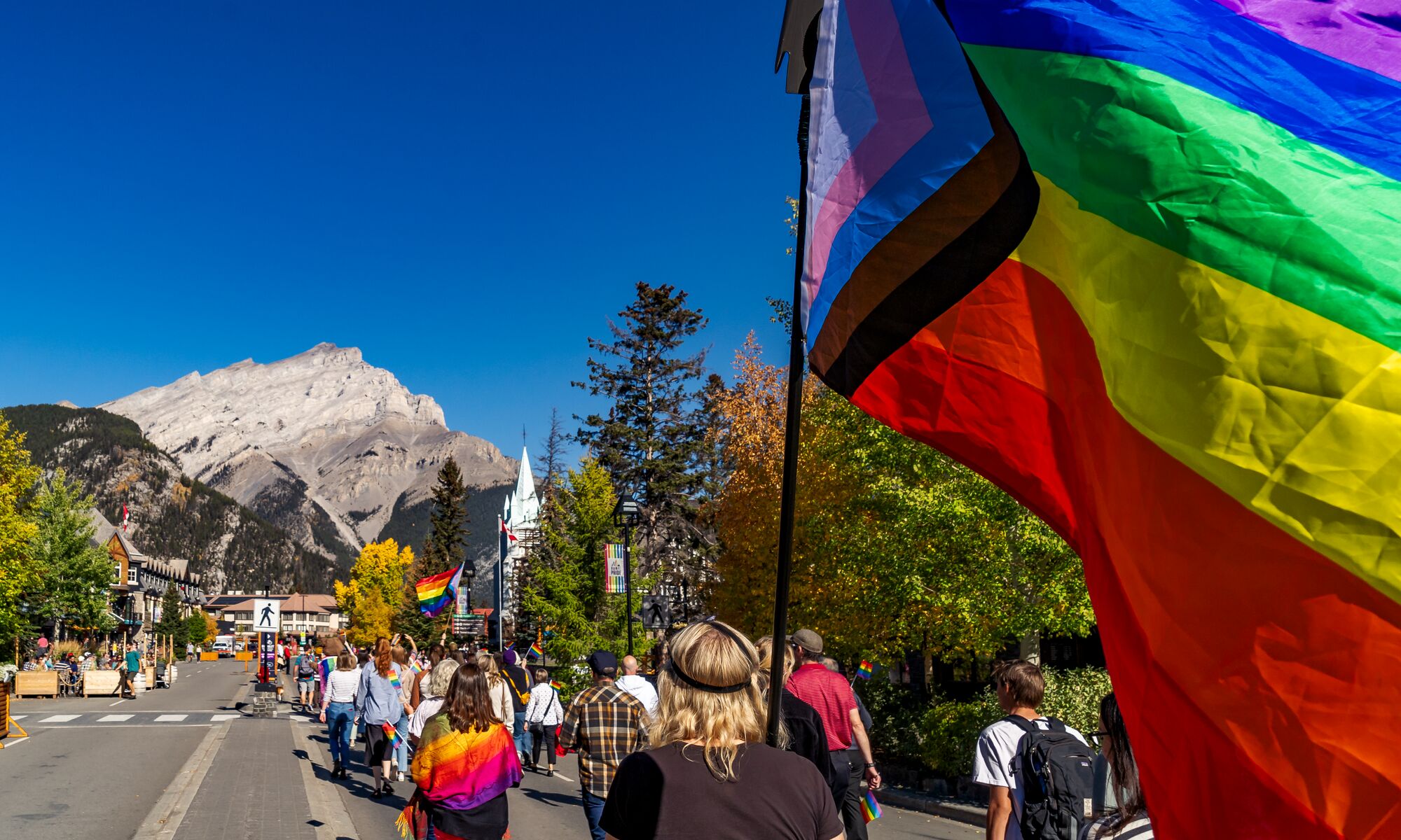 A Pride flag on Banff Ave during the Pride Parade in Banff National Park. 