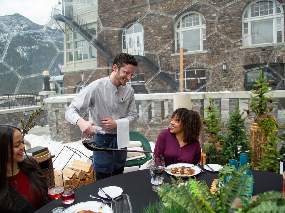 Visitors enjoying a meal in the 360 Dome at the Fairmont Banff Springs.