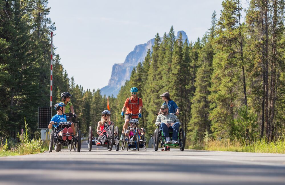 A group of people exploring the Bow Valley Parkway by bike and wheelchair