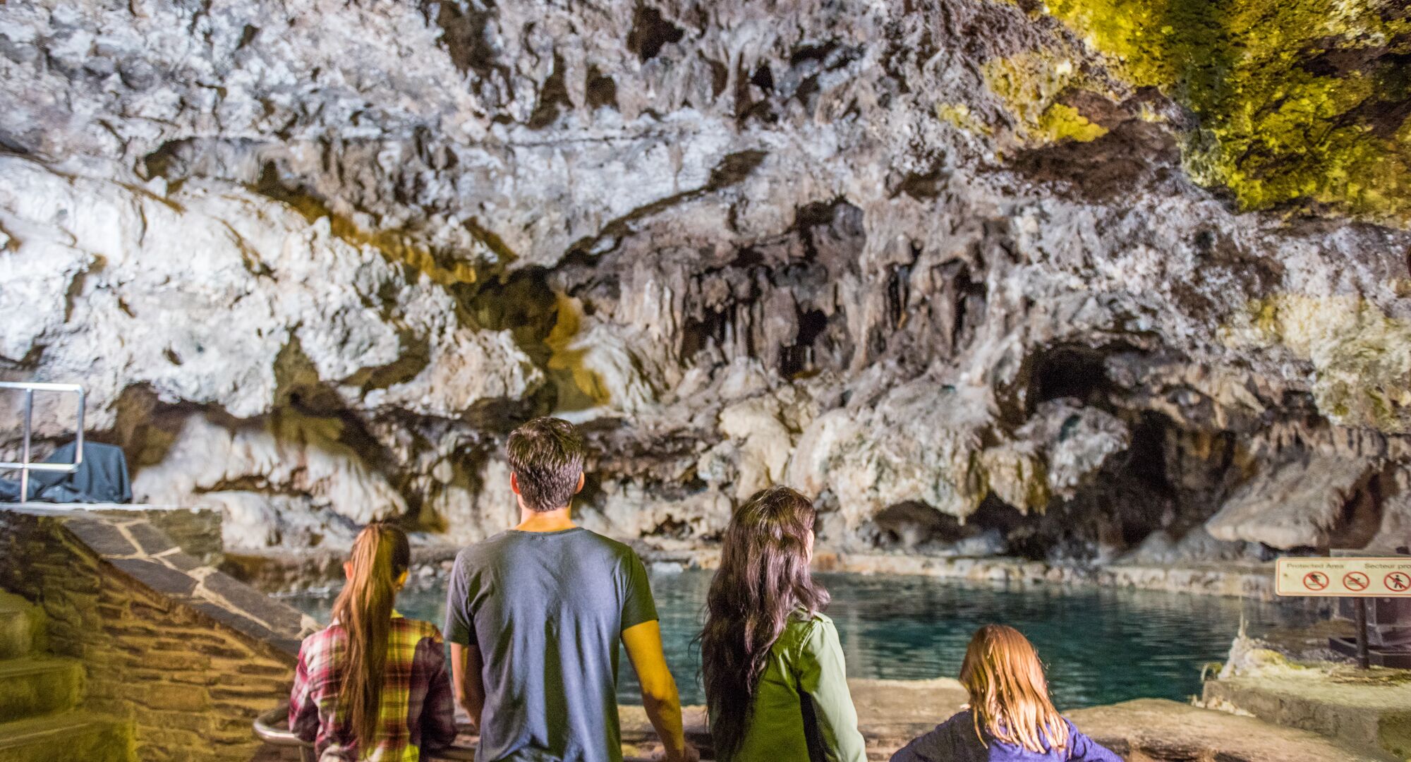 Family of four in the cave at the Cave & Basin National Historic Site