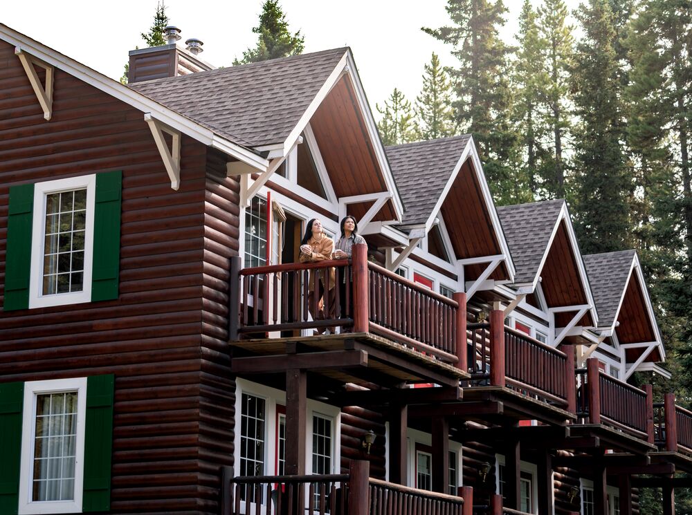 A couple on their balcony at Paradise Lodge in Banff National Park.