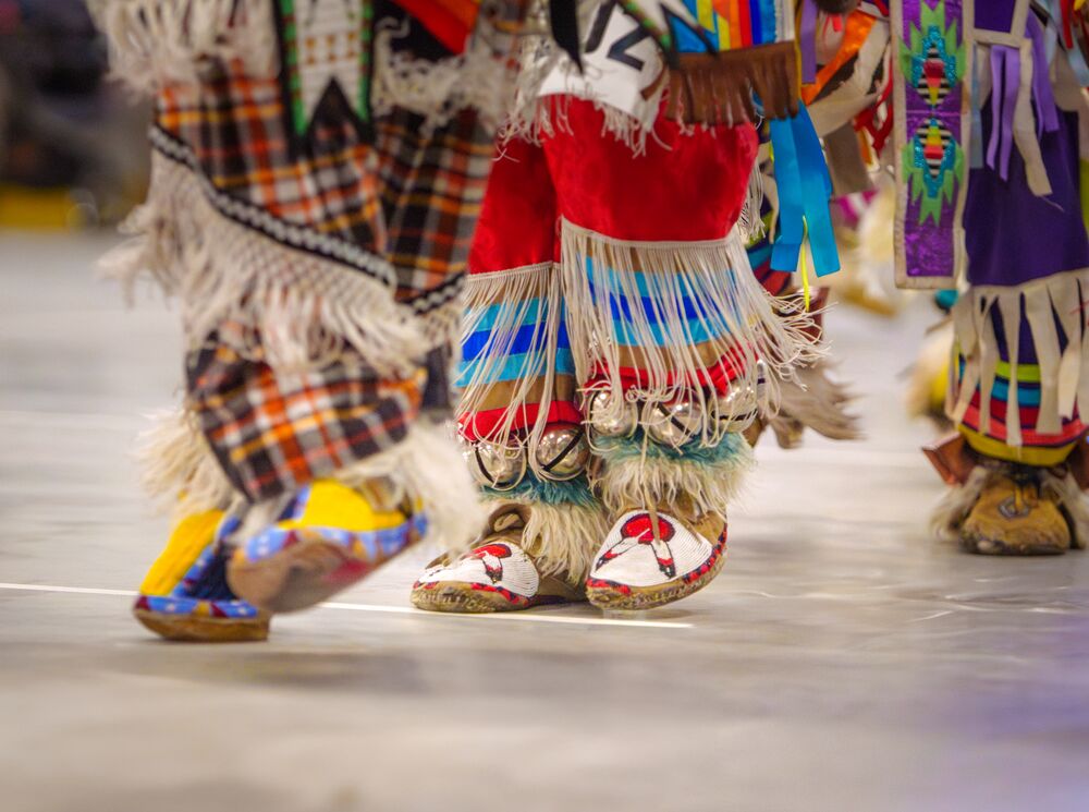 Participants at the 2024 Intercultural Powwow dressed in traditional regalia held at the Fenlands Recreation Centre in Banff on June 8.