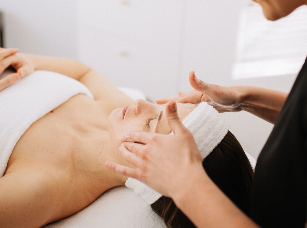 A woman goes to Remedy Skincare & Spa for Facial spa in Banff Avenue.