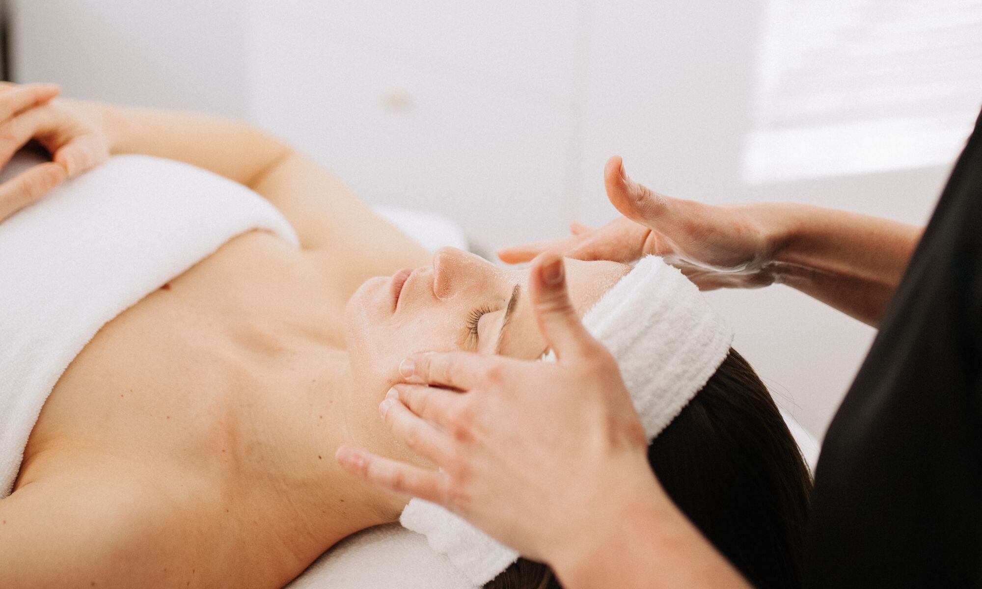 A woman goes to Remedy Skincare & Spa for Facial spa in Banff Avenue.