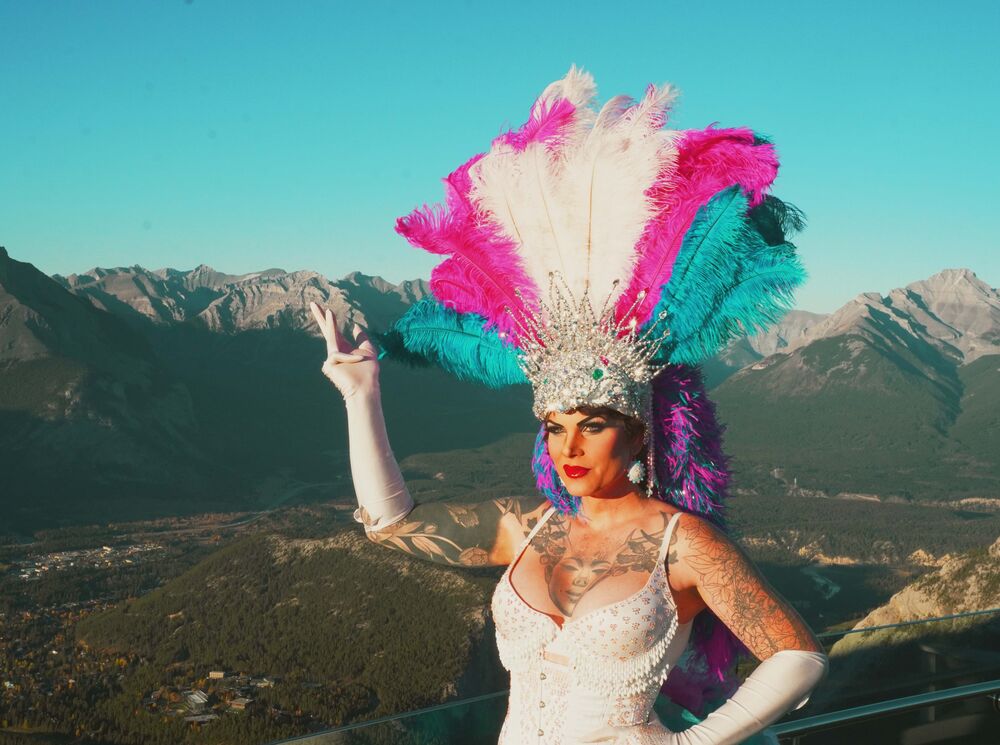 Drag Queen with mountains in the background.