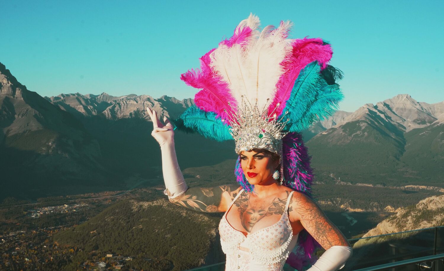 Drag Queen with mountains in the background.