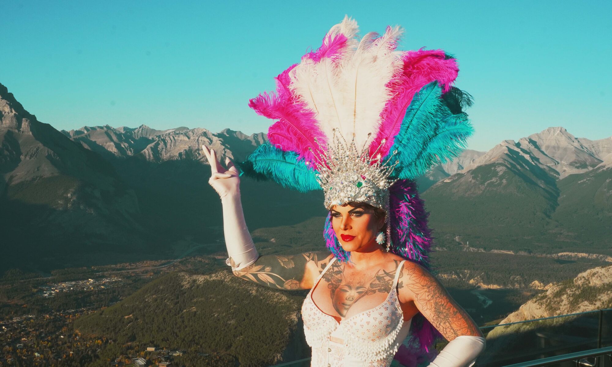 Drag Queen with mountains in the background.