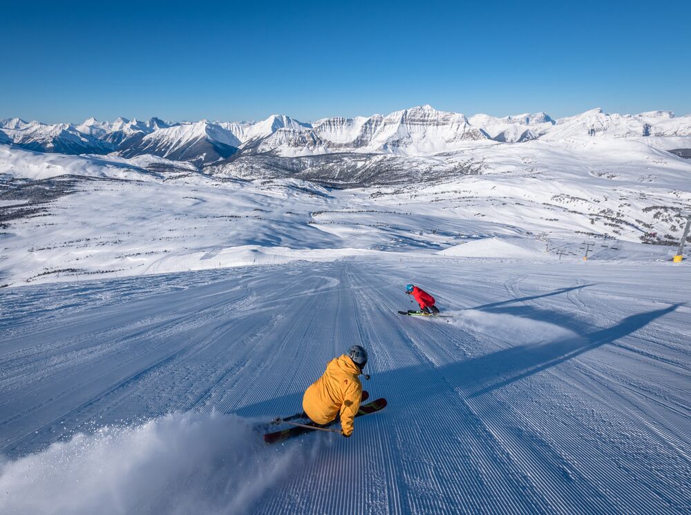 Two people skiing at Sunshine Village in Banff National Park
