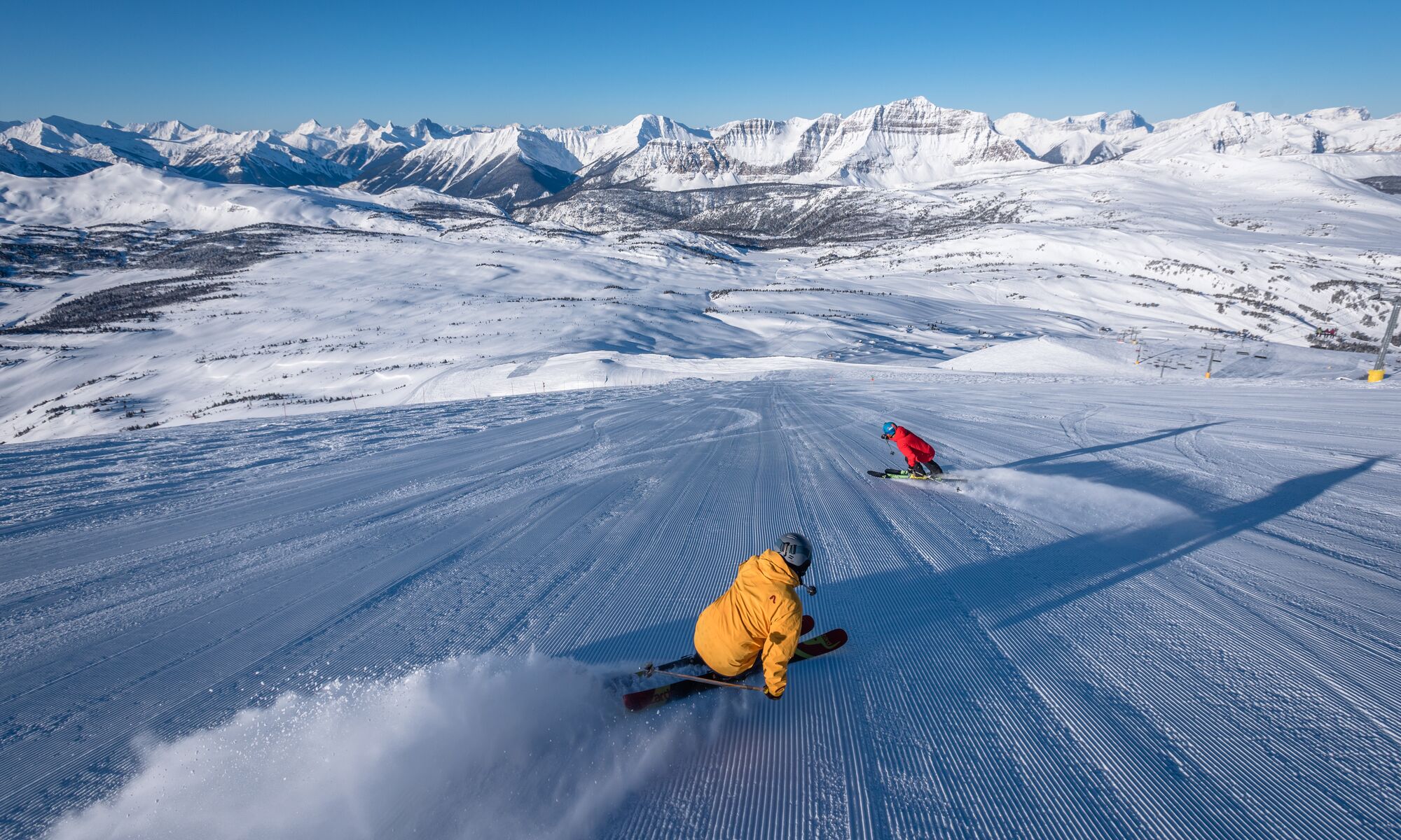 Two people skiing at Sunshine Village in Banff National Park