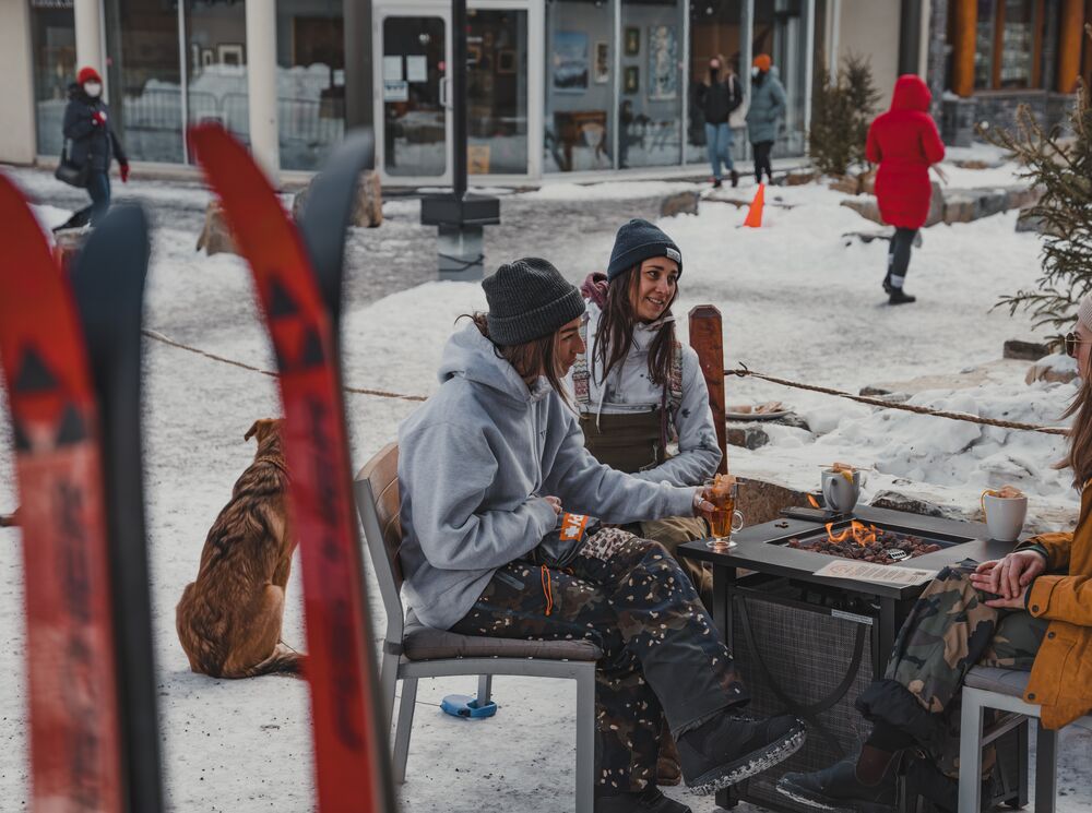 Three friends enjoying après ski at Bear Street Tavern.