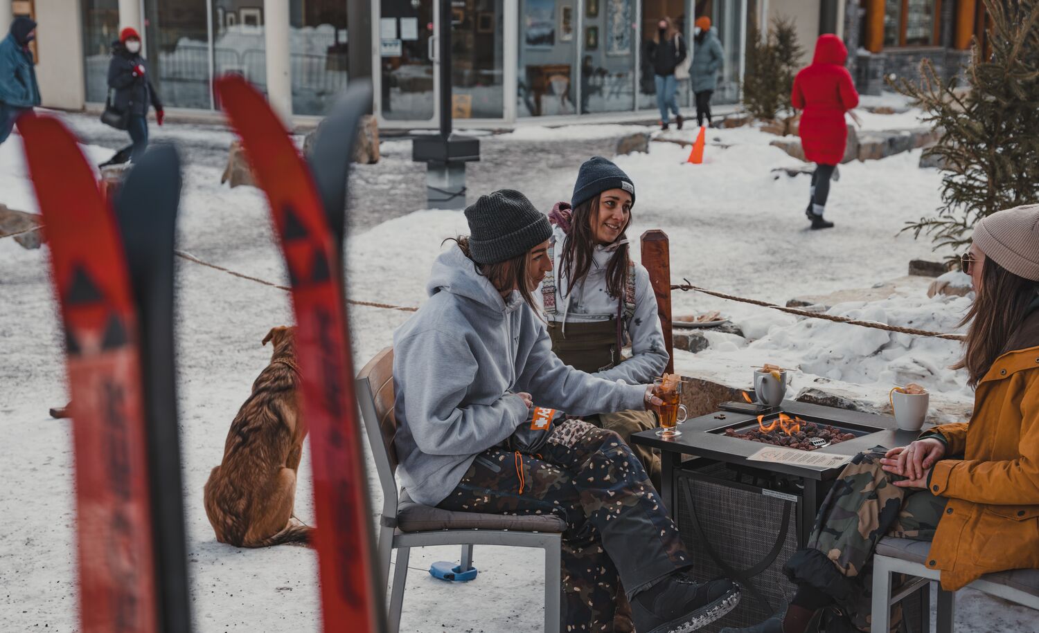 Three friends enjoying après ski at Bear Street Tavern.