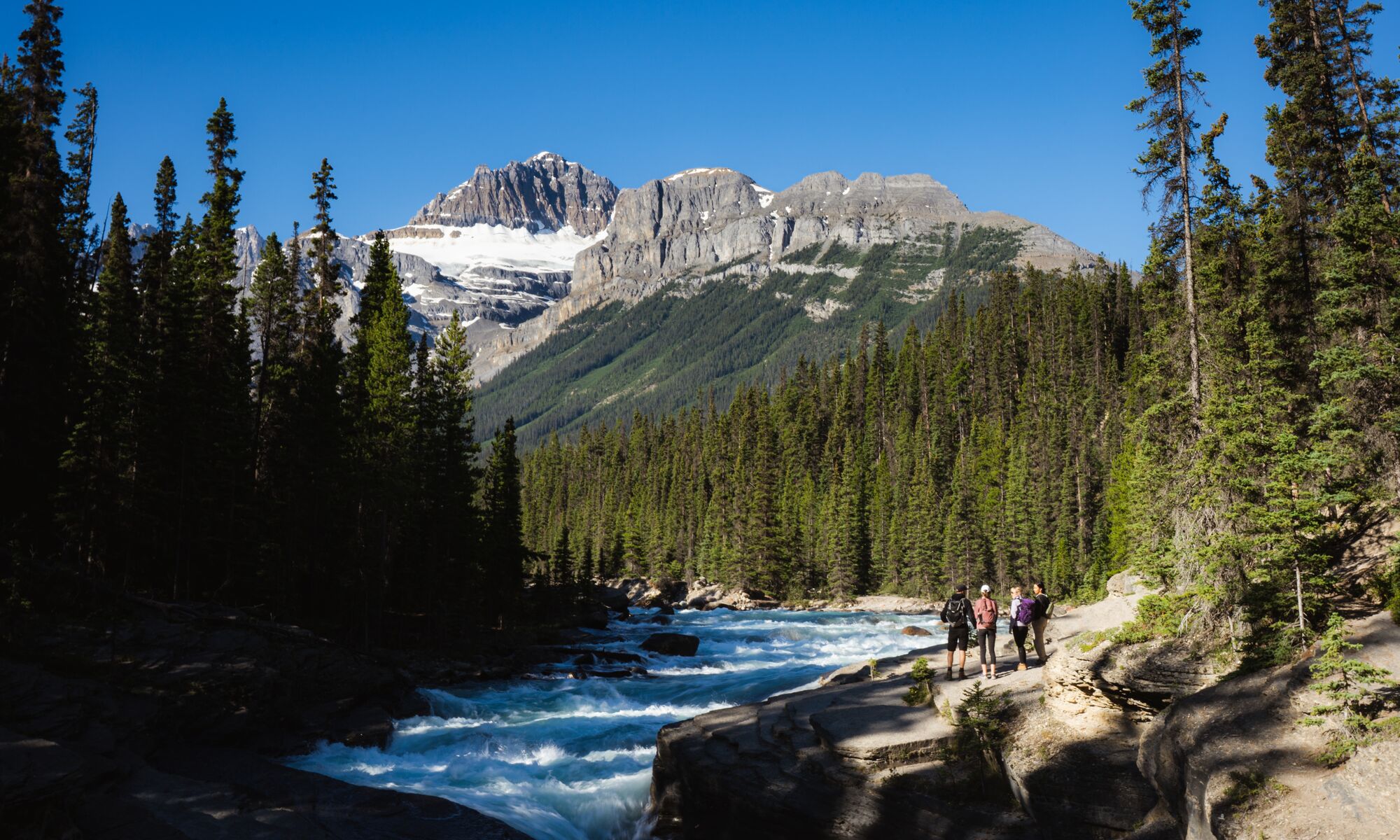Friends exploring Mistaya Canyon on the Icefield Parkway in Banff National Park.