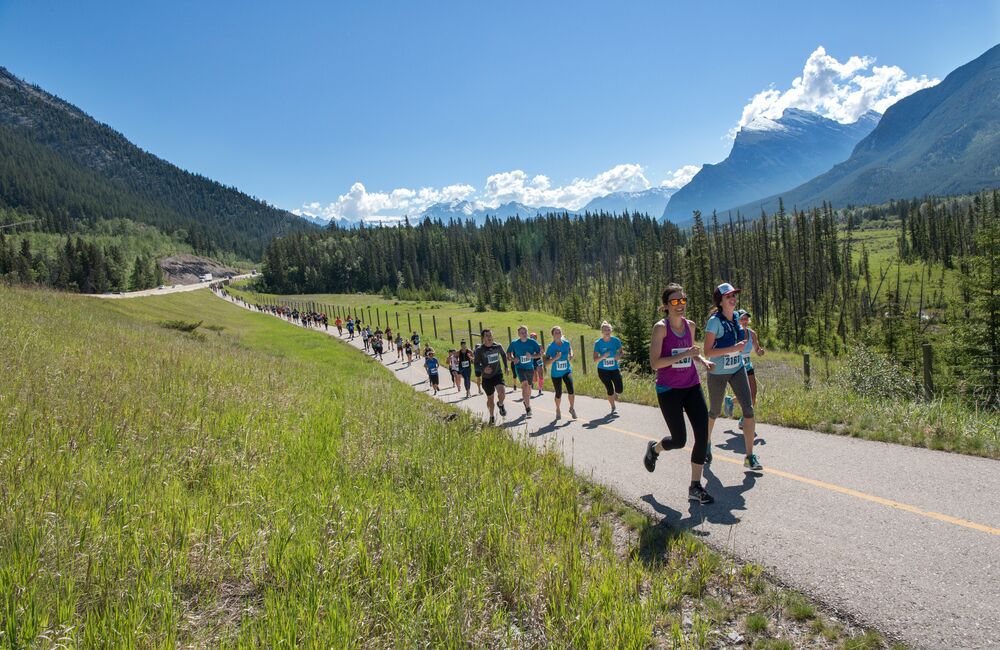 People running along the legacy trail in Banff for the Banff Marathon