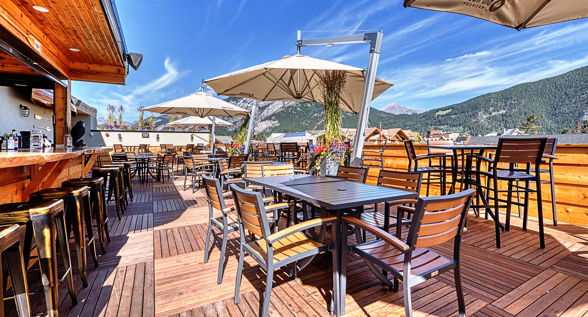 A rooftop patio on a summer day at the Rose & Crown located in Banff National Park
