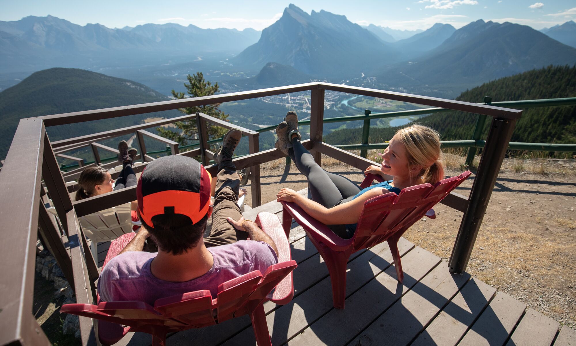 People enjoying the summer sightseeing gondola at Mt Norquay on a beautiful day in Banff National Park.