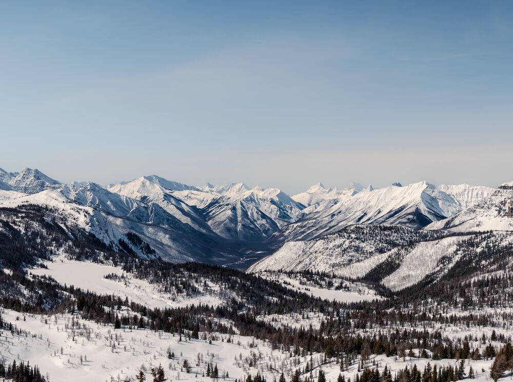 Looking out over a snowy landscape at Banff Sunshine Village in Banff National Park.