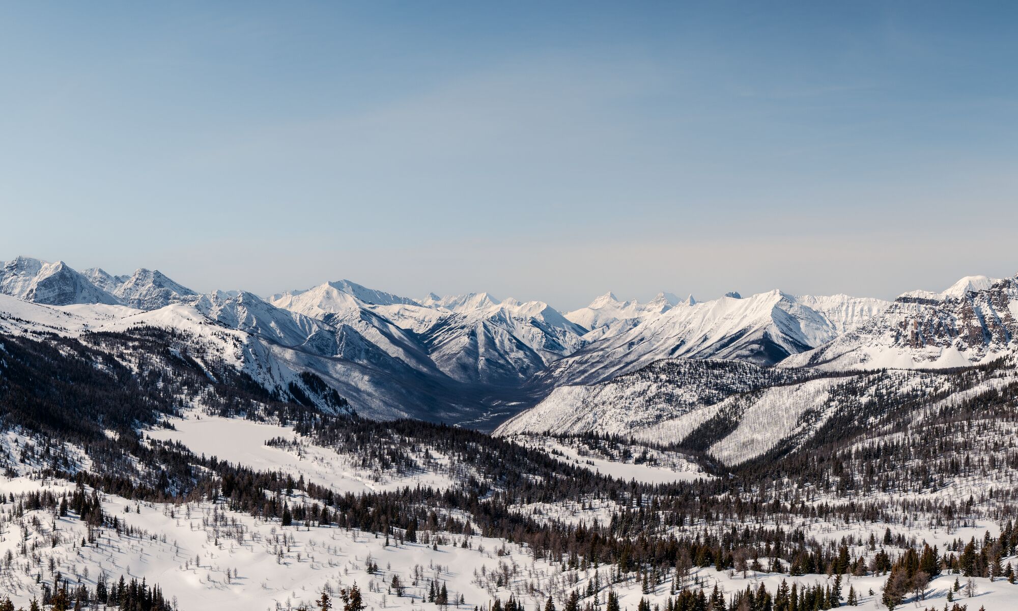 Looking out over a snowy landscape at Banff Sunshine Village in Banff National Park.