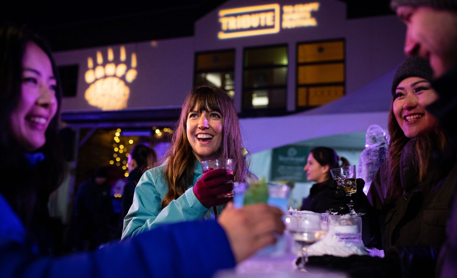 People enjoy a drink at the Tribute to Craft festival in Banff.