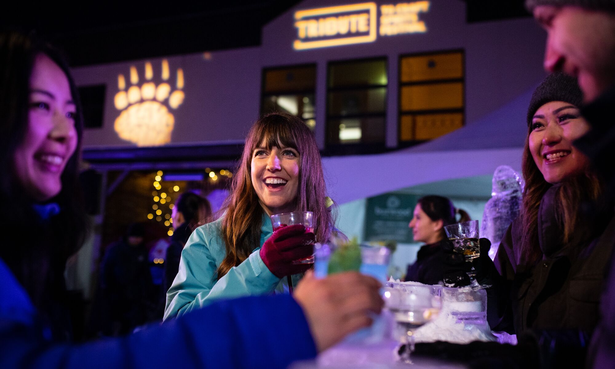 People enjoy a drink at the Tribute to Craft festival in Banff.