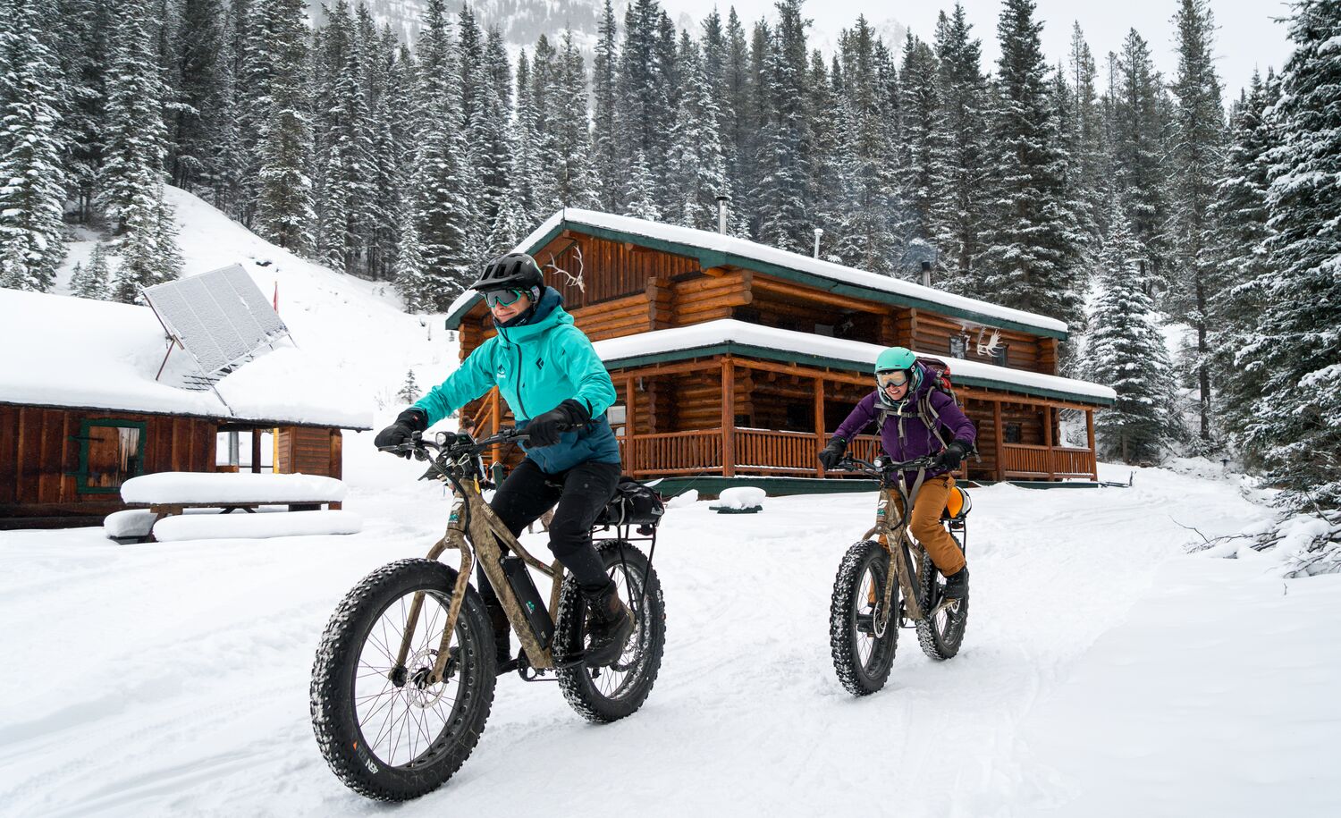 People fat bike at sundance Lodge in the winter in Banff National Park.