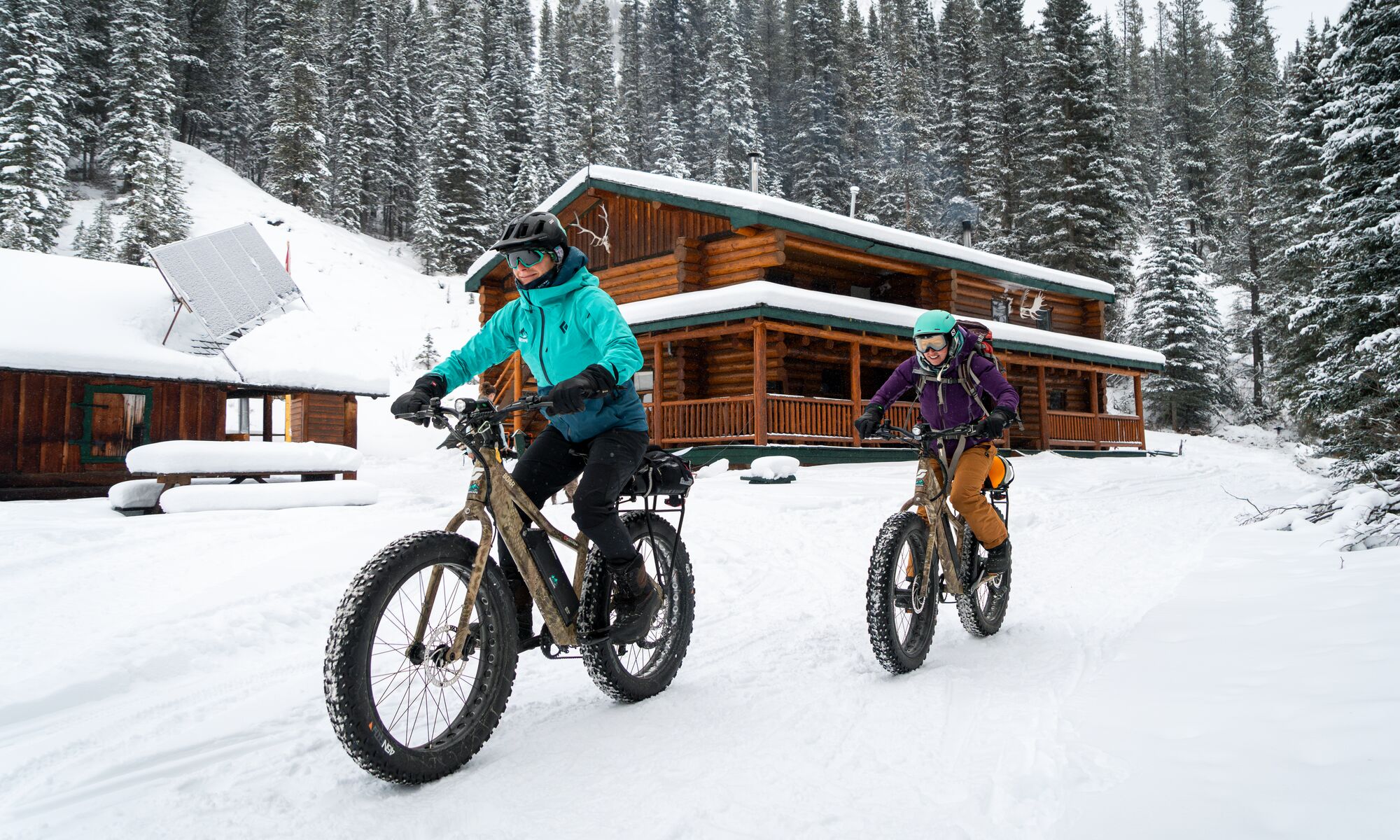 People fat bike at sundance Lodge in the winter in Banff National Park.