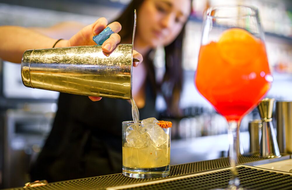 A bartender pours out a mocktail at Earl's in Banff National Park