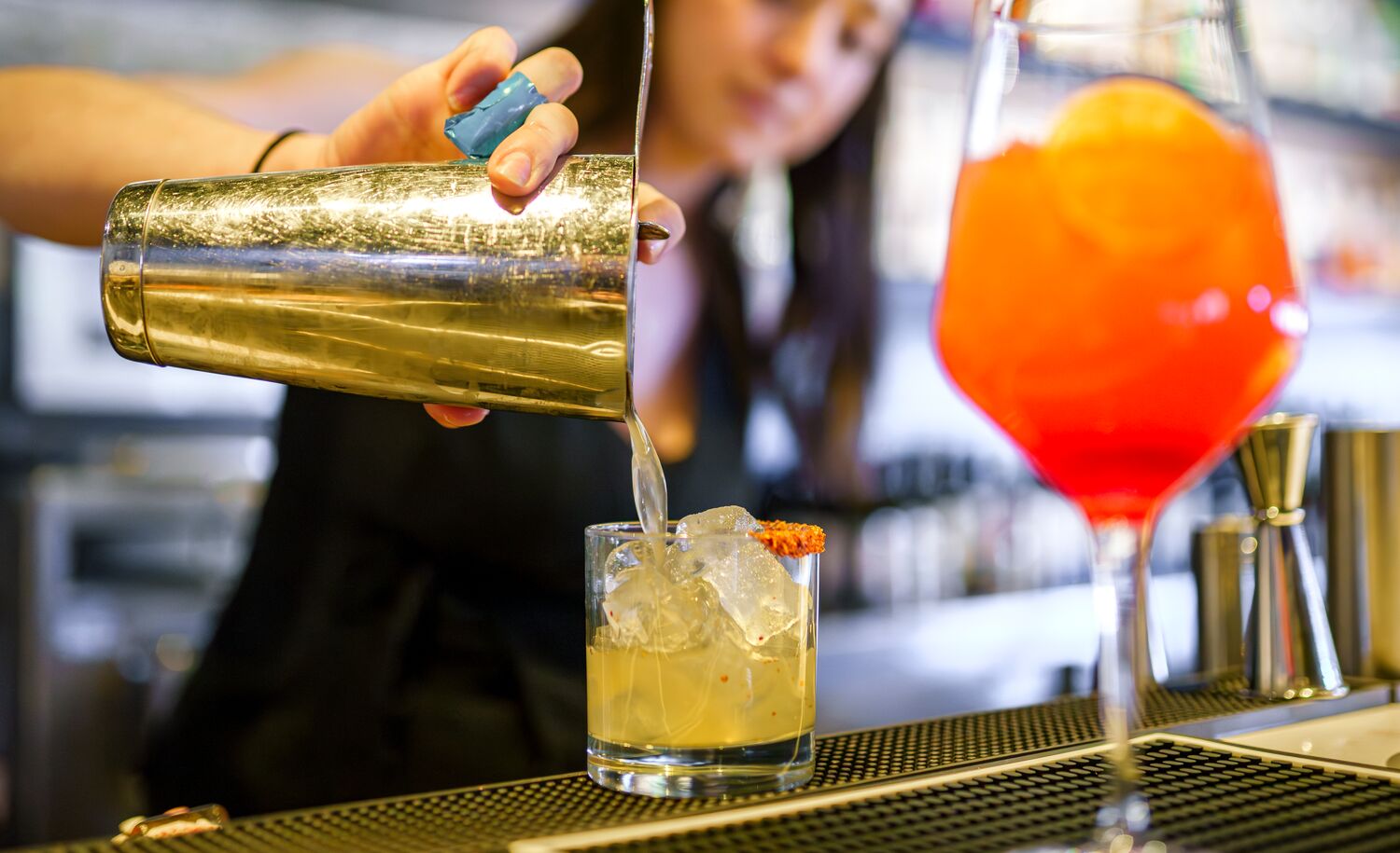 A bartender pours out a mocktail at Earl's in Banff National Park