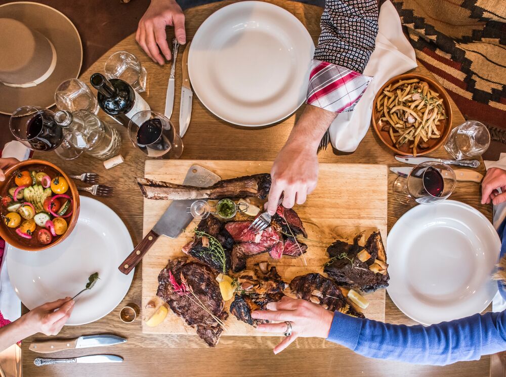 An aerial view of a table with food on it at Chuck's Steakhouse in Banff, Canada