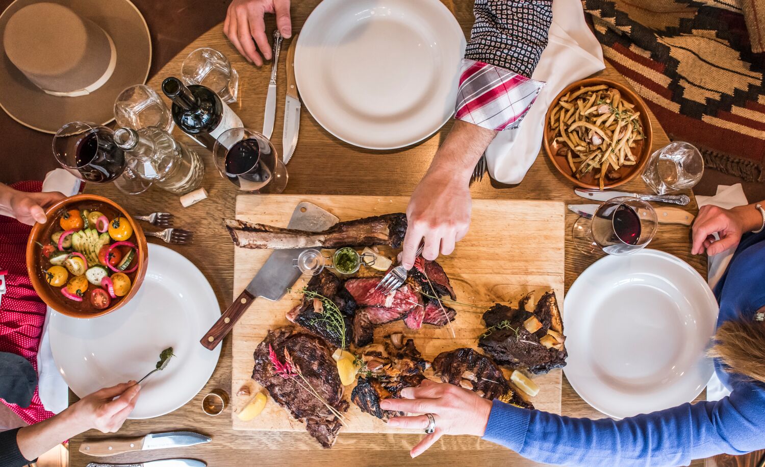 An aerial view of a table with food on it at Chuck's Steakhouse in Banff, Canada