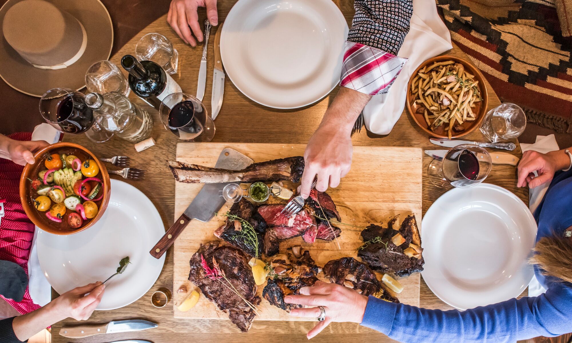 An aerial view of a table with food on it at Chuck's Steakhouse in Banff, Canada