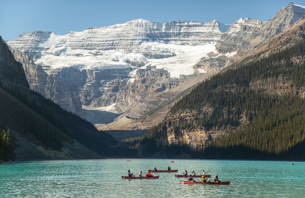 A group of people canoeing on Lake Louise in Banff National park