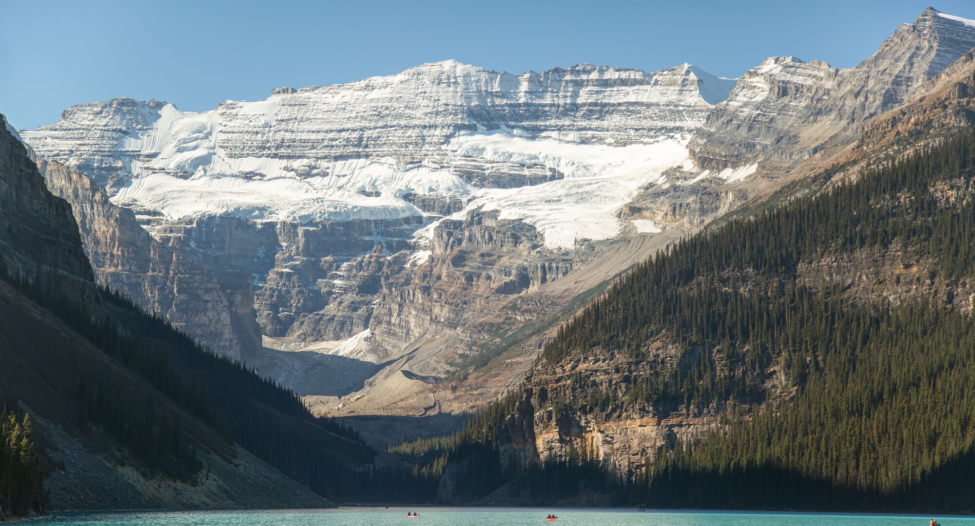 A group of people canoeing on Lake Louise in Banff National park