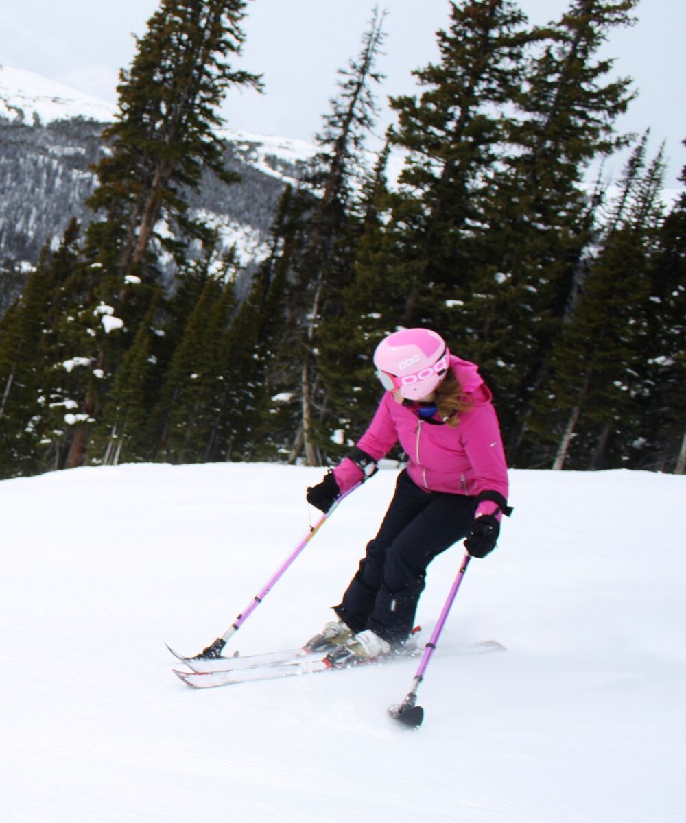 A person adaptive skiing at a ski resort in Banff National Park
