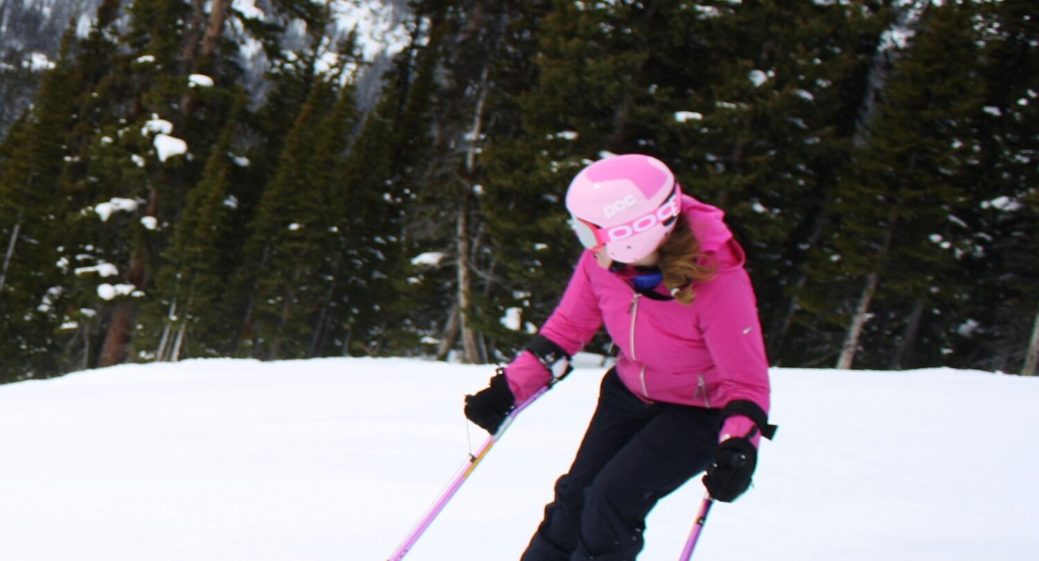 A person adaptive skiing at a ski resort in Banff National Park