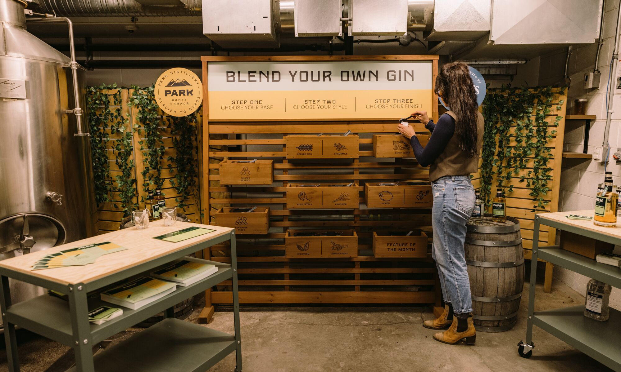 A woman tries the Blend your Own Gin experience at PARK Distillery in Banff National Park.