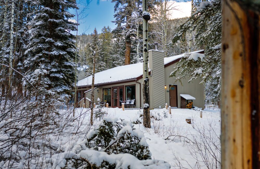 Exterior shot of the woodland cabins at the Juniper Hotel in Banff National Park